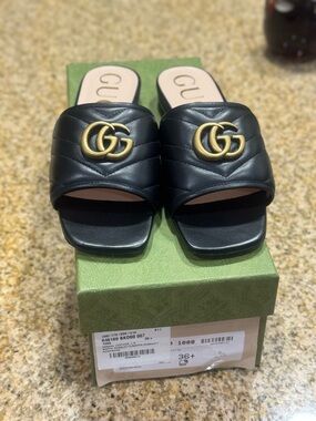 Gucci Black Quilted Leather Slide Mules with Gold GG Hardware